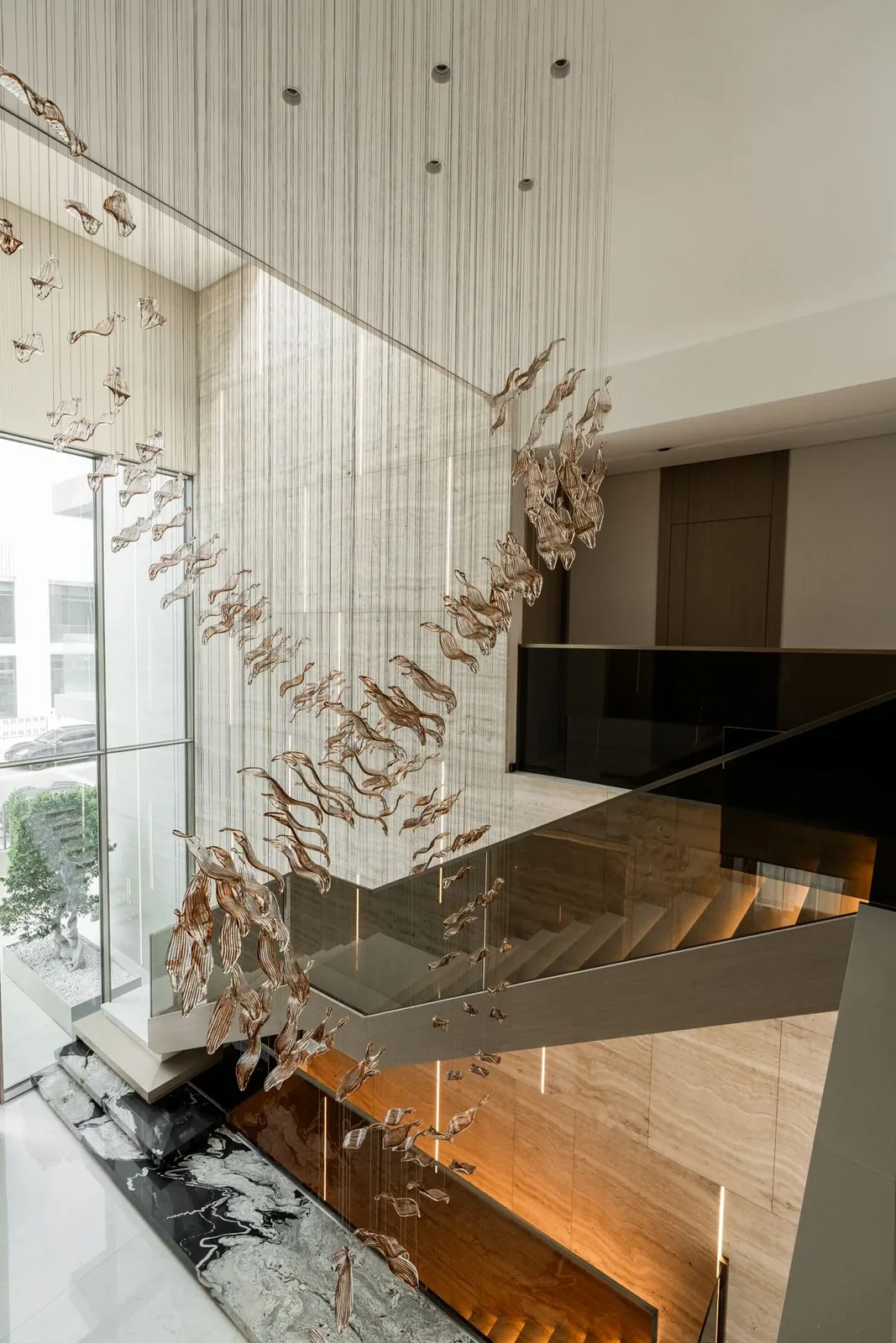 Five-metre crystal chandelier in the double-height entrance at Villa Alma
