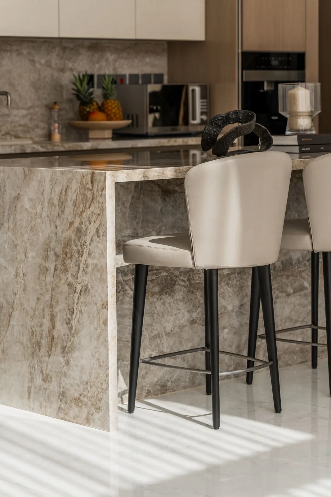 Marble kitchen island and bar stools at Villa Alma