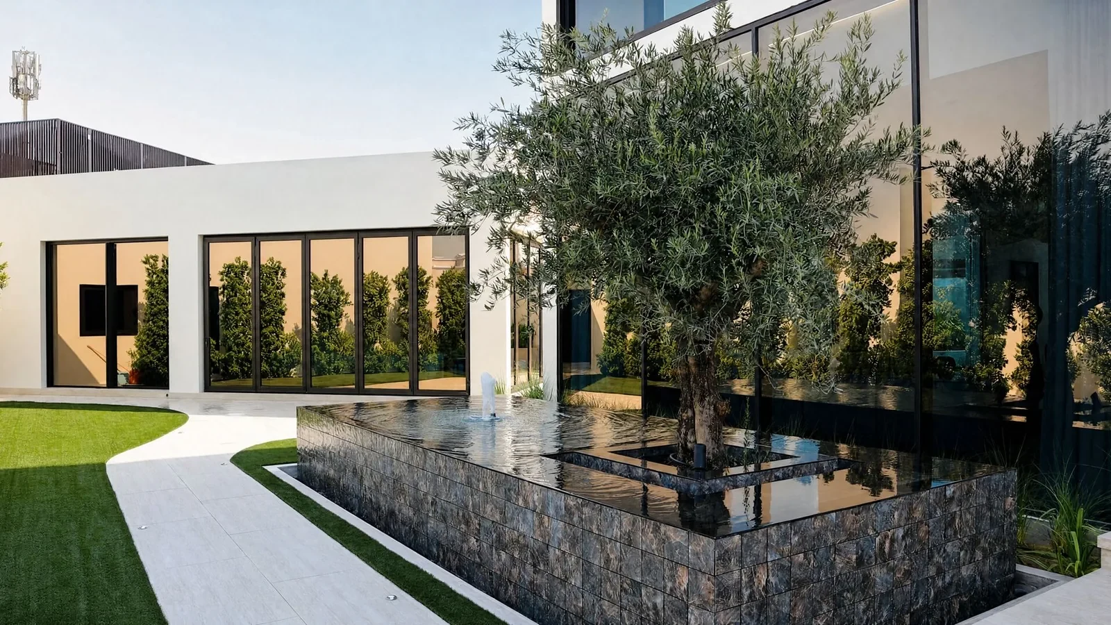 Olive tree and water feature in the Villa Cielo garden